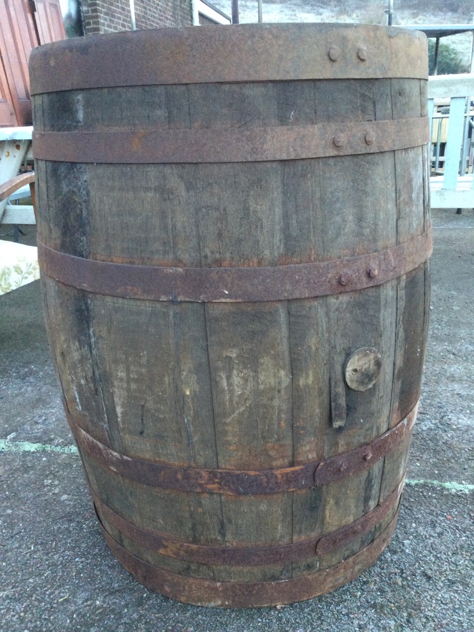 An old oak whiskey barrel, the staves bound by six riveted metal strap bands. (35in) - Image 2 of 3