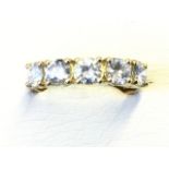 An 18ct yellow gold diamond ring with five brilliant cut claw set diamonds weighing over a carat,