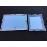 Two silver painted mirrors in foliate gesso moulded frames. (2)