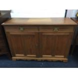 An Edwardian mahogany sideboard with rectangular moulded top above two frieze drawers and panelled