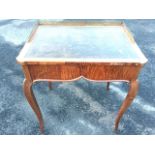 A nineteenth century French mahogany desk, the rectangular crossbanded top with gilt tooled