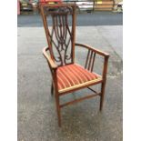 An art nouveau late Victorian armchair, the tapering back with satinwood banding to frame