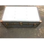 An ‘Overpond’ aluminium school trunk with paper lined interior.