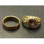 An 18ct gold wedding band; and a Victorian foliate scrolled ring set with shield shaped bevelled