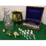 A cased set of six fruit knives and forks, with pearlised handles and silver plate blades and tines;