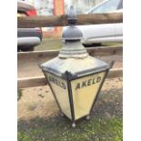 A Victorian style streetlamp enclosure with tapering glass panels named Akeld, having hinged door