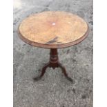 A circular Victorian oak occasional table, the moulded top supported on an octagonal tapering column