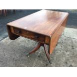 A nineteenth century mahogany table with rounded drop leaves, having knobbed frieze drawers to