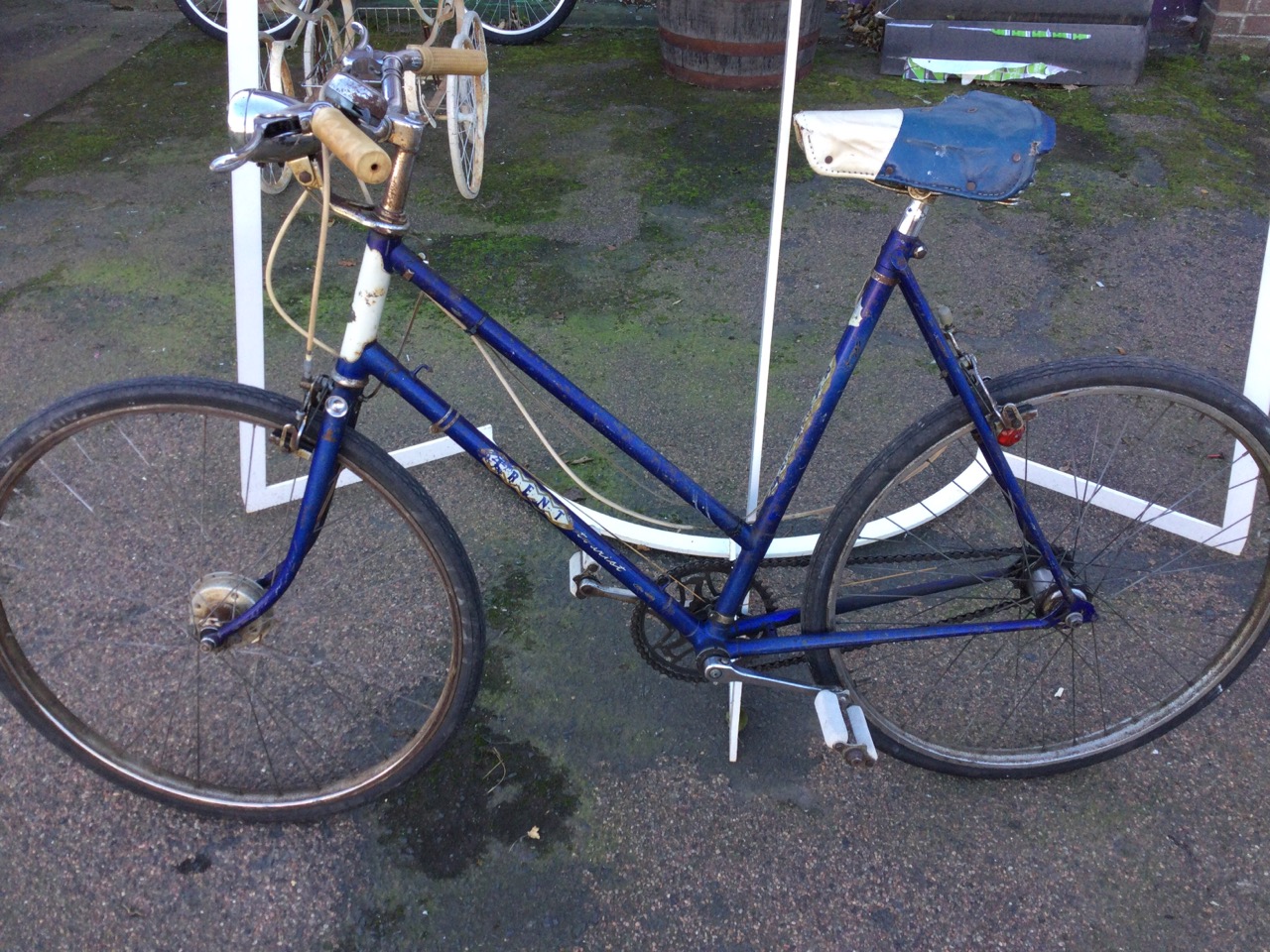 A 70s Raleigh Trent ladies bicycle with sprung seat, lights, three-speed gears, cable brakes, etc.