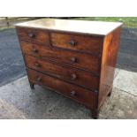 An early nineteenth century mahogany chest of drawers, the rectangular top with reeded edge above