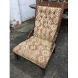 An late 19th c ,mahogany upholstered arm chair the back rail with leaf carving framing roundel above