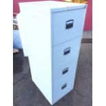 A four-drawer metal filing cabinet. (8.5in x 24.5in x 52.25in)