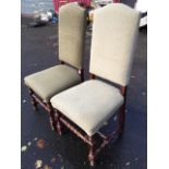 A pair of Queen Anne style upholstered hall chairs, with tall arched backs above sprung seats,