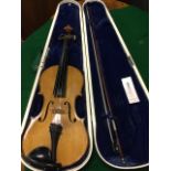 A coffin cased violin & bow, the Czechoslovakian instrument being a Stradivarius copy, re-polished