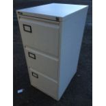 A three-drawer metal filing cabinet. (18.5in x 24.5in x 40.25in)