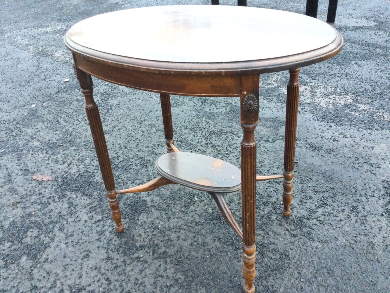 An oval mahogany occasional table, the moulded top on reeded column legs with applied floral - Image 3 of 3