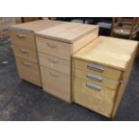 Three modern dwarf chests, each with three graduated drawers, one on casters. (3)