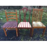 A Hepplewhite style mahogany dining chair with arched back and pierced splat above an upholstered