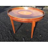 An oval mahogany tray-top coffee table inlaid with satinwood oval panel, the top framed by