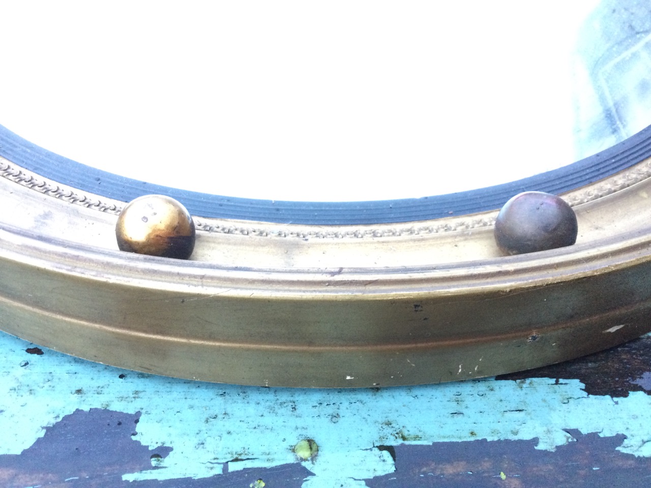 A circular Regency style gilt convex mirror, the concave moulded framed mounted with balls, having - Image 2 of 3