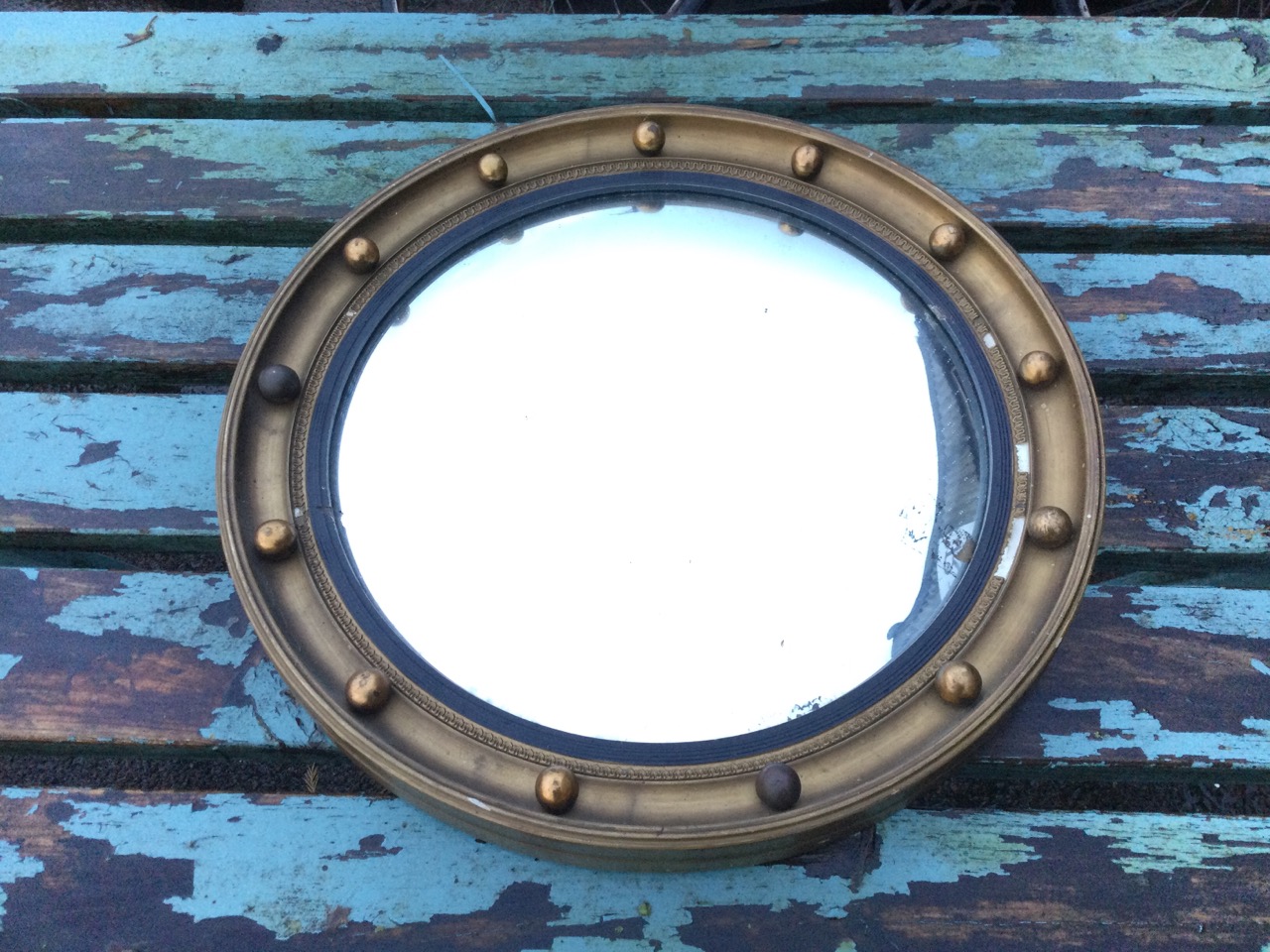 A circular Regency style gilt convex mirror, the concave moulded framed mounted with balls, having - Image 3 of 3