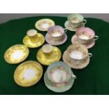 A Paragon Damask Rose teaset with matching colour coordinated saucers, with floral gilt