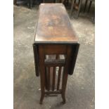 A mahogany Sutherland table, the moulded top with satinwood cross banded inlay, the leaves supported