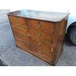 A Victorian mahogany chest of drawers with rectangular rounded top above two short and three long