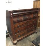 A Victorian mahogany chest with cushion moulded frieze drawer above three deep shaped drawers,