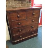 A Victorian mahogany chest of drawers, the rectangular rounded top above two short and three long