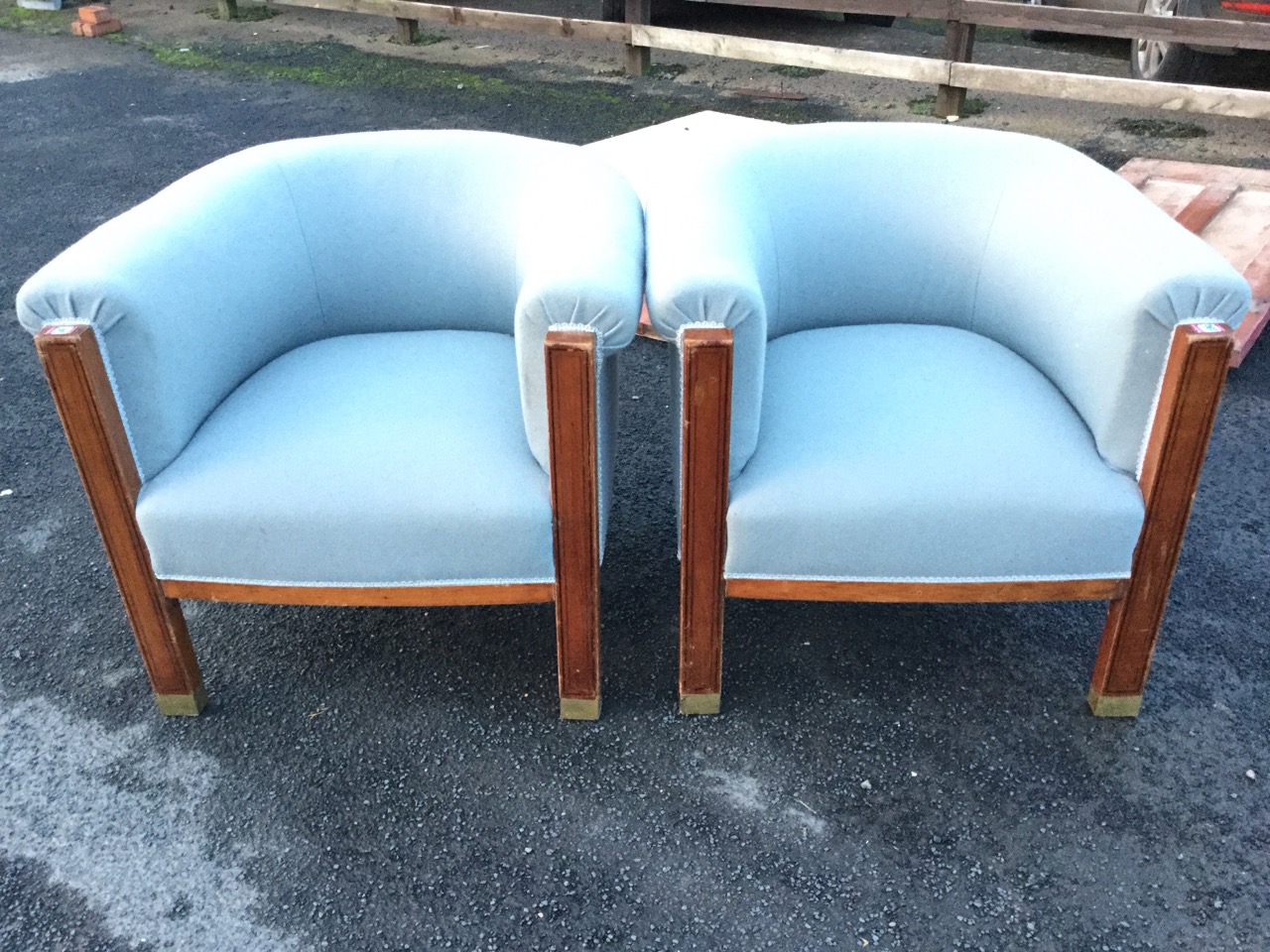 A pair of Empire walnut armchairs with contemporary grey baize upholstery, the rounded horseshoe