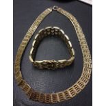 A 9ct gold hallmarked necklace with rectangular hinged panels; and a 9ct gold bracelet of similar