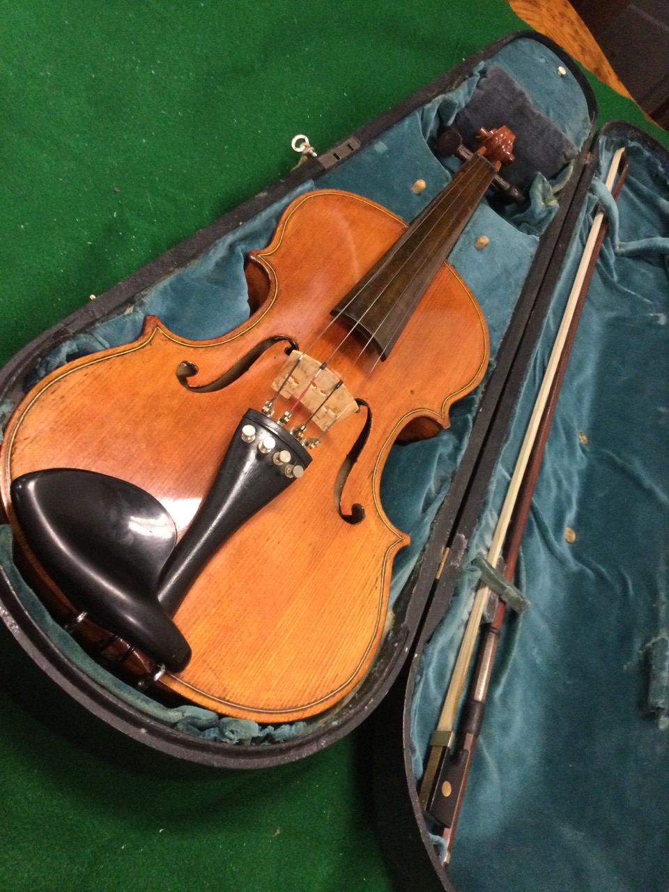 A coffin cased violin & bow, the re-polished instrument with boxwood & ebony stringing having twin-