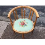 An Edwardian captains style armchair inlaid with boxwood stringing, the rounded back on slats