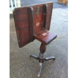 A nineteenth century mahogany tip-top occasional table with rectangular top on baluster turned