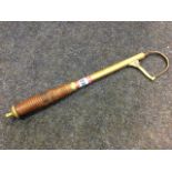 A nineteenth brass gaff by Pape of Newcastle, the telescopic implement with ribbed mahogany