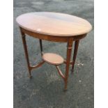 An oval Edwardian mahogany occasional table, the moulded top inlaid with chequered stringing, raised