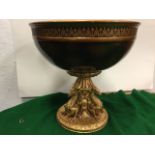 A large decorative fruit comport, the bowl with anthemion style border on gilded fluted stand cast
