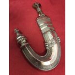 A late nineteenth century silver mounted janbiya, the curved scabbard with engraving dated circa