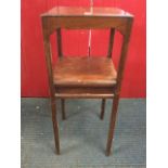 A Georgian style mahogany nightstand, with square moulded top above shaped aprons with conforming