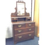 A stained Edwardian dressing table, the back with bevelled mirror on carved supports above a