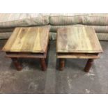 A pair of square hardwood side tables with iron mounts, the moulded square tops raised on turned