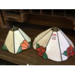 A Tiffany style leaded glass lampshade, with eight peach coloured panels set with red flowers and