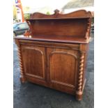 A Victorian mahogany chiffonier, the scrolled back with rectangular moulded shelf on pierced