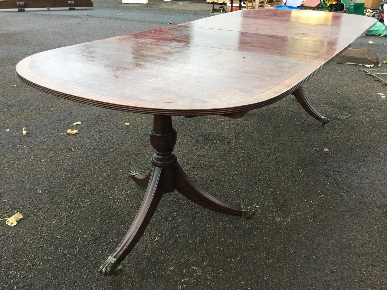 A Georgian style mahogany twin pedestal dining table, the crossbanded top with ebony stringing - Image 2 of 3