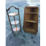 A 60s tapering mahogany corner unit with three graduated shelves; and an oak cakestand with arched