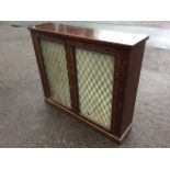 A nineteenth century Gillow style mahogany bookcase cabinet, with rectangular top above