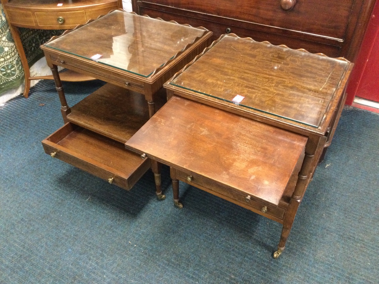 A pair of mahogany tables with plate glass tops framed by raised scalloped galleries above slides, - Image 2 of 3