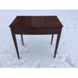 An antique bowfronted mahogany side table, the oak lined frieze drawer mounted with ring handles,