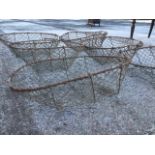 A set of five oval wirework baskets, the frames having hand-holes to ends. (23in x 16.5in x 8in) (